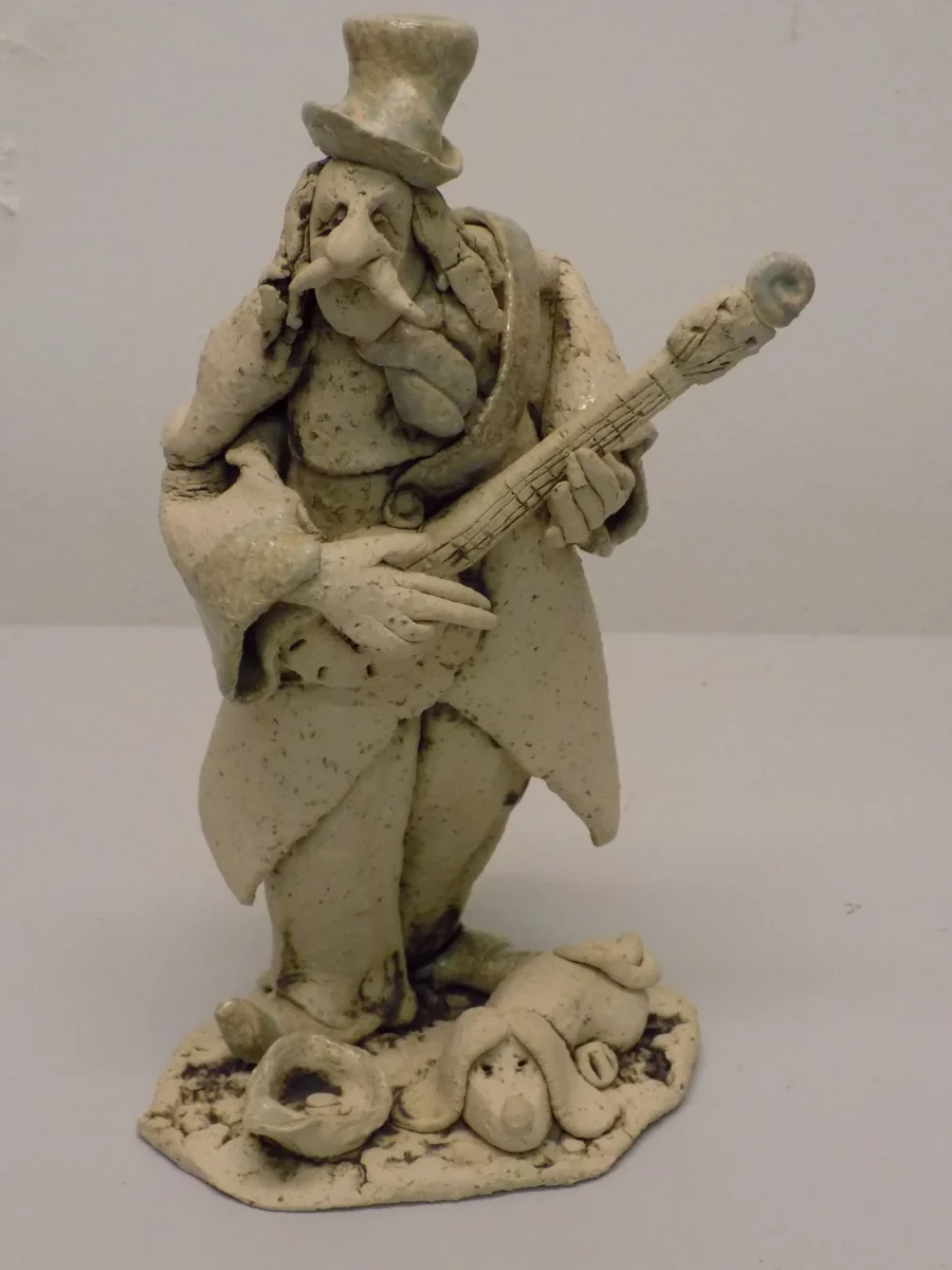 Original Stoneware sculpture of a busking musician by renowned artist Stewart Taylor